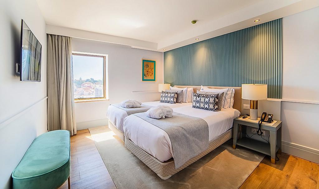VIP Executive Suites do Marquês Hotel, Hotelzimmer mit Bett und Sitzbereich