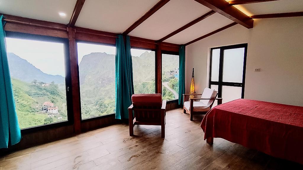 Casa Cavoquinho, Detailaufnahme der Betten und der Einrichtung in einem der Hotelzimmer.