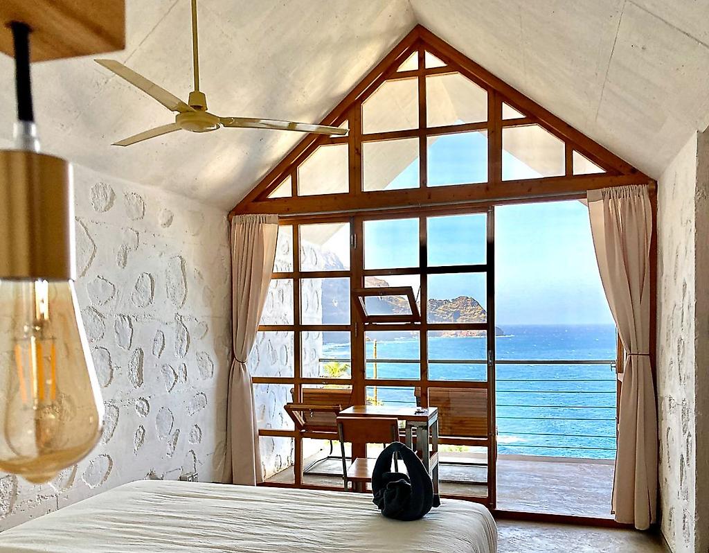 Mamiwata Eco Village, Gemütliches und komfortabel eingerichtetes Hotelzimmer für einen erholsamen Aufenthalt.