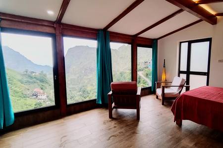 Casa Cavoquinho, Detailaufnahme der Betten und der Einrichtung in einem der Hotelzimmer.